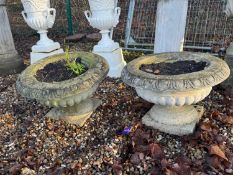 A pair of reconstituted garden planters Of modern manufacture