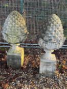 A pair of reconstituted pineapple finials Of modern manufacture