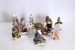 A collection of fourteen Royal Crown Derby paperweights, of modern manufacture,