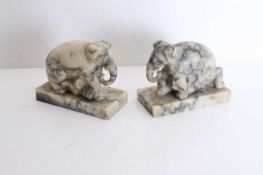 A pair of veined marble elephant bookends, 20th century,