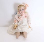 A late Victorian bisque headed doll, 20th century,