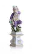 A Meissen figure of a boy with a wine goblet, emblematic of Autumn, late 19th century,