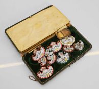 A collection of enamelled wine labels, 20th century,