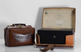 A leather-cased jewellery box and a 'Doctors' bag, circa 1900,