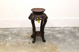 A Chinese cherry wood heavily carved jardiniere stool, 20th century,