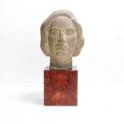 Manner of Eric Gill, a stone carved head,