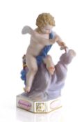 A Meissen figure of a seated Cupid, 19th century,