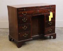 A mahogany kneehole desk, circa 1900,