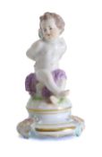 A Meissen figure of a seated cherub, circa 1900,