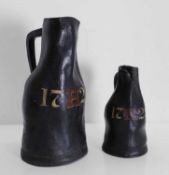 Two leather bombards, dated '1722',