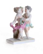 A Meissen group of two putti with floral garlands, late 19th century,