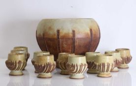 ▲ A Bernard Rooke stoneware punch bowl and goblets, circa 1973,