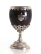 A George III silver mounted coconut cup,