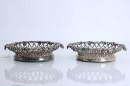 A pair of silver-plated wine coasters, mid 19th century,