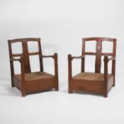 A near pair of Indian rosewood lounge chairs, early 20th century, Bombay School of Arts & Crafts,