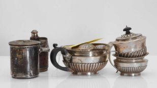 A Victorian silver teapot and matching milk jug,