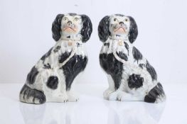 A large pair of Staffordshire pottery spaniels, late 19th century,