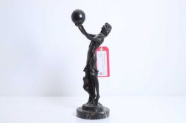 Thérèse Theodas (contemporary), a bronze of a girl with a globe,