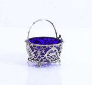 A silver swing handled pierced sugar basket,