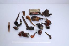 A collection of carved treen pipes, 19th century and later,
