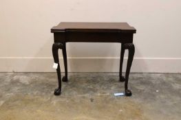 A George II mahogany fold-over card table, circa 1750,