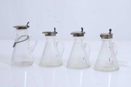 Four whisky noggins, with silver mounts,