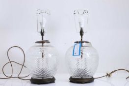 A pair of globular cut glass table lamps, of recent manufacture,