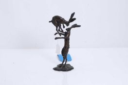 A bronze sculpture of two fighting hares, 20th century,