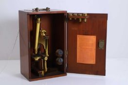 A brass compound binocular microscope, late 19th century,