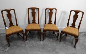 A set of four George II walnut dining chairs, circa 1740,