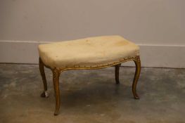 A giltwood stool, 19th century,