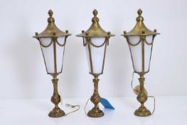 A set of three brass and glass table lamps, 20th century,