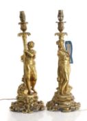 A pair of gilt metal table lamps,