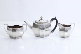 A silver composed three piece tea service,