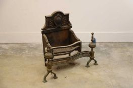 A cast iron and brass fire grate with decorative backplate, late 19th to early 20th century,