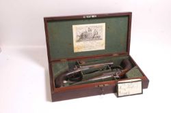 A pair of Charles Moore patent cased double-barrelled percussion pistols, c.1830,