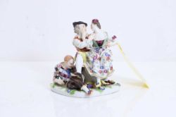 A Meissen figure group, c.1870, 'The indiscreet Harlequin',