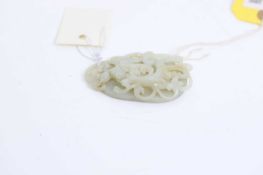 A Chinese reticulated jade oval plaque, 20th century,