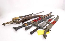 A collection of Middle Eastern and European swords and daggers, 20th century,