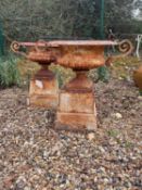 A pair of cast iron garden urns, 20th century,