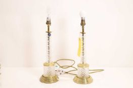 A pair of brass and glass table lamps, of recent manufacture,