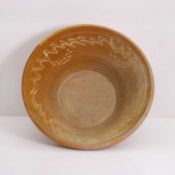 A large slipware bowl, early 20th century,