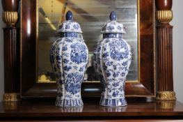 A pair of blue and white lidded baulster jars, 19th century,