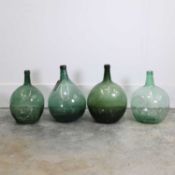A group of four glass olive jars, early 20th century,
