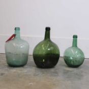 A collection of three demijohns, 20th century, Spanish,