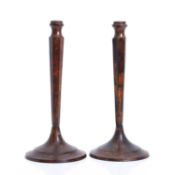 A pair of metal faux tortoiseshell patinated candlesticks, early 20th century,