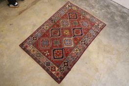 A small Persian rug, late 20th century,