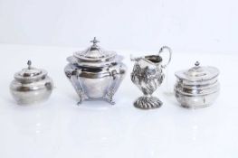 A group of three covered silver sugar bowls,