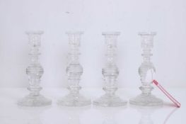 A set of four Regency style cut glass candlesticks, 20th century,