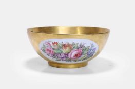 A large gilt porcelain punchbowl, 19th century,